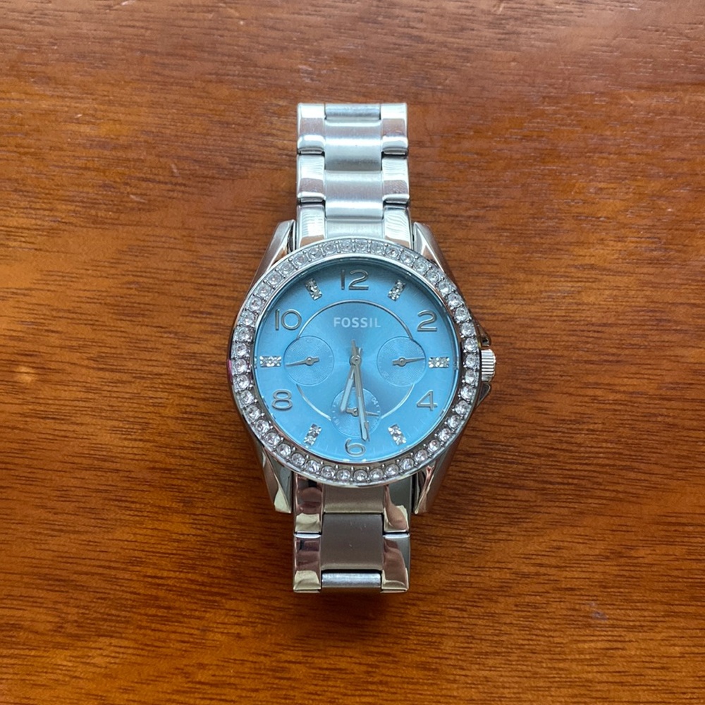 Fossil Watch. Diamond circle around sky blue face. All Stainless steel.